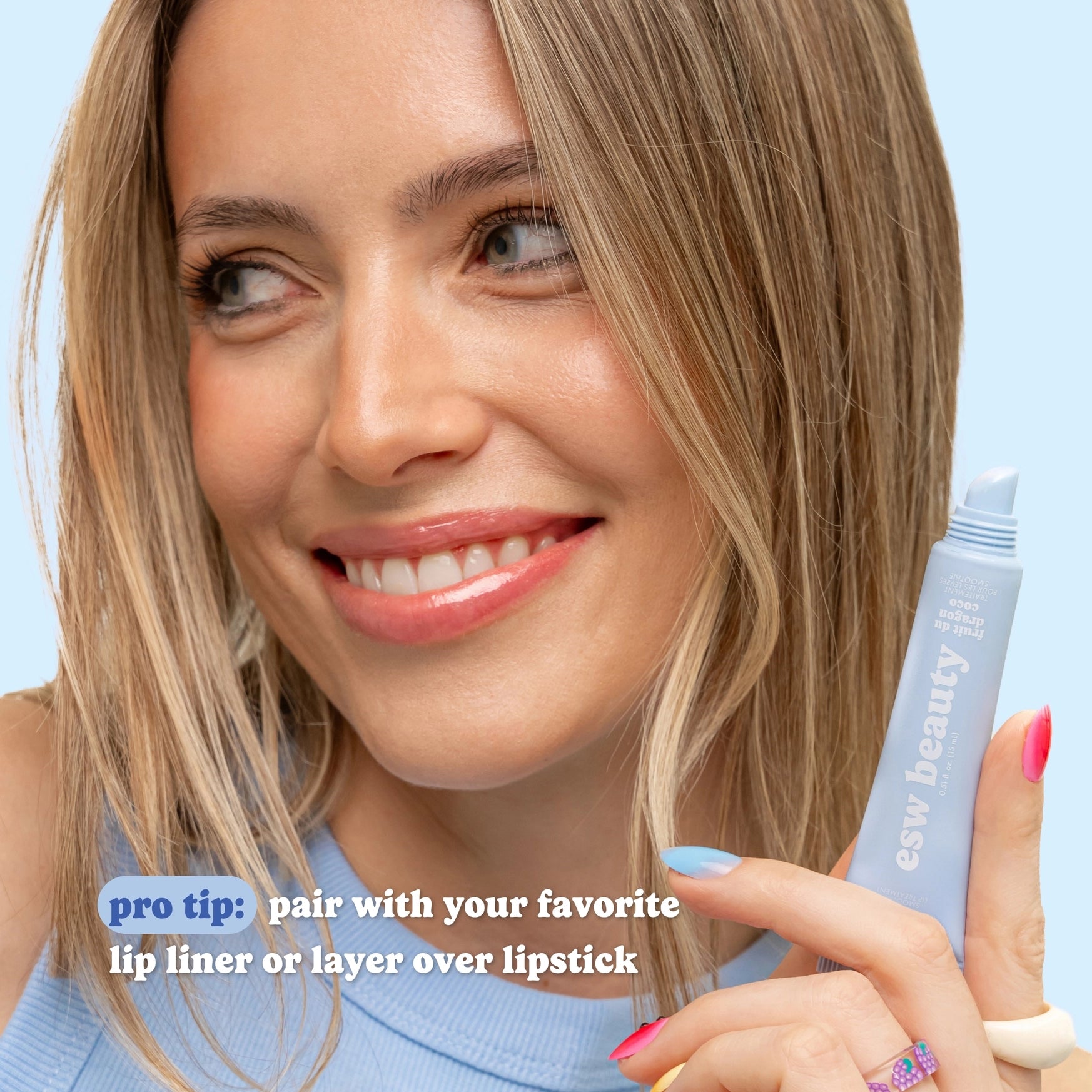 Woman holding a makeup product with text overlay on a light blue background