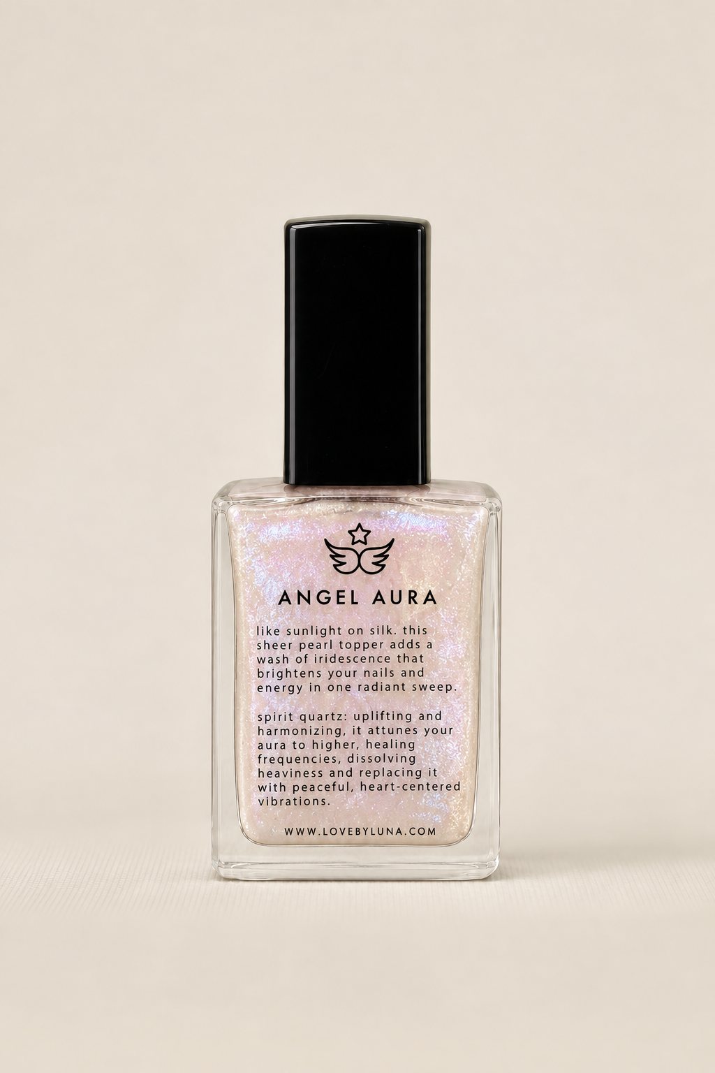 A bottle of Angel Aura nail polish with a black cap, showing a shimmering light pink and silver iridescent polish inside, set against a solid light beige background.