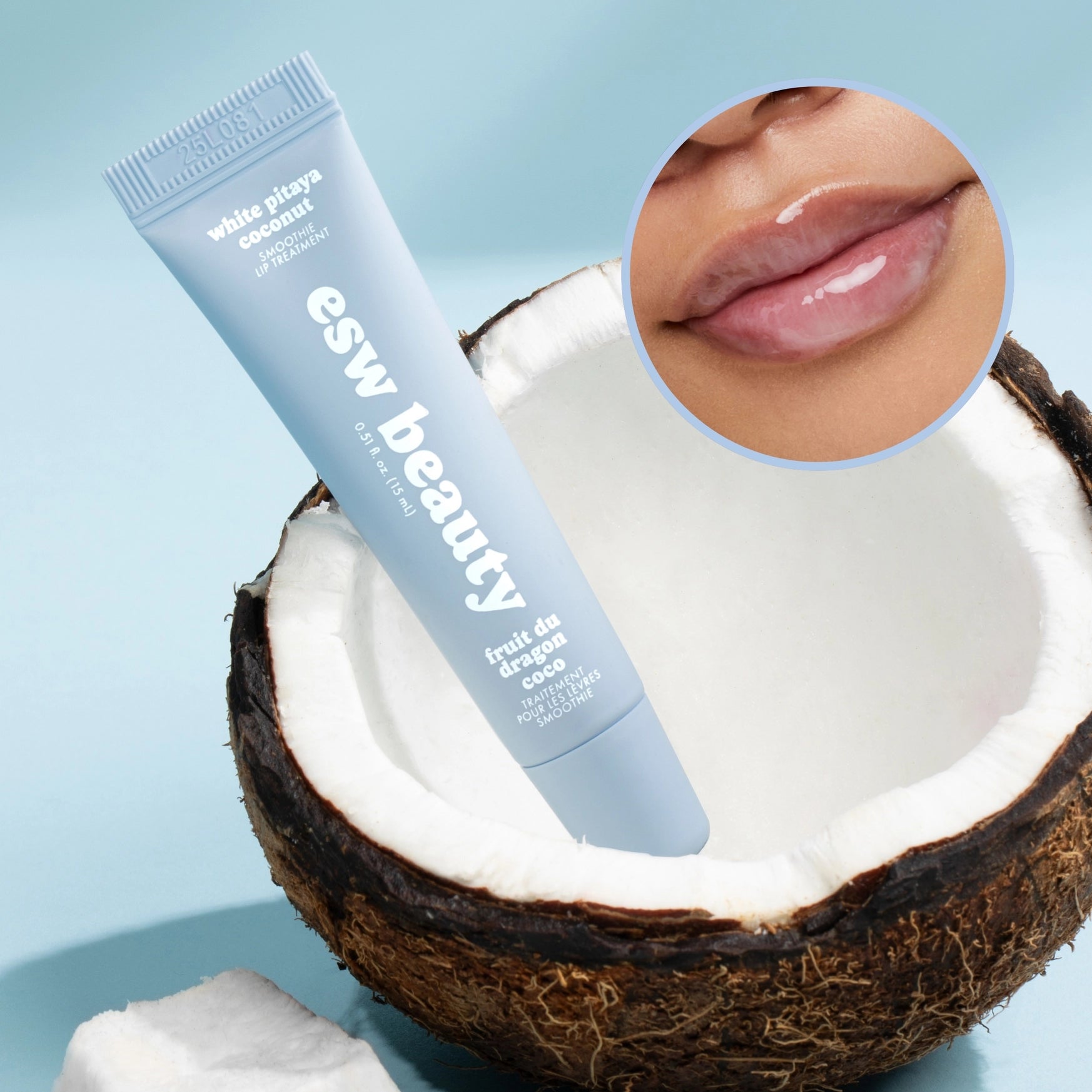 Lip balm tube with 'esw beauty' branding inside a coconut on a light blue background.