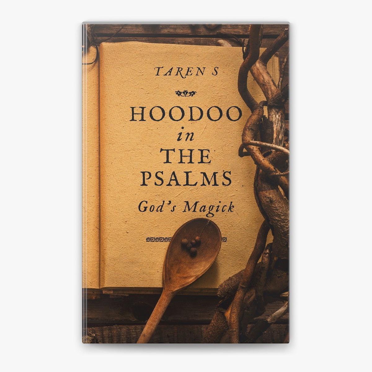 A book titled 'Hoodoo in the Psalms: God's Magick' by Taren S, featuring a rustic cover design with a parchment-like background, dark vine branches, and a wooden spoon on a light gray background.