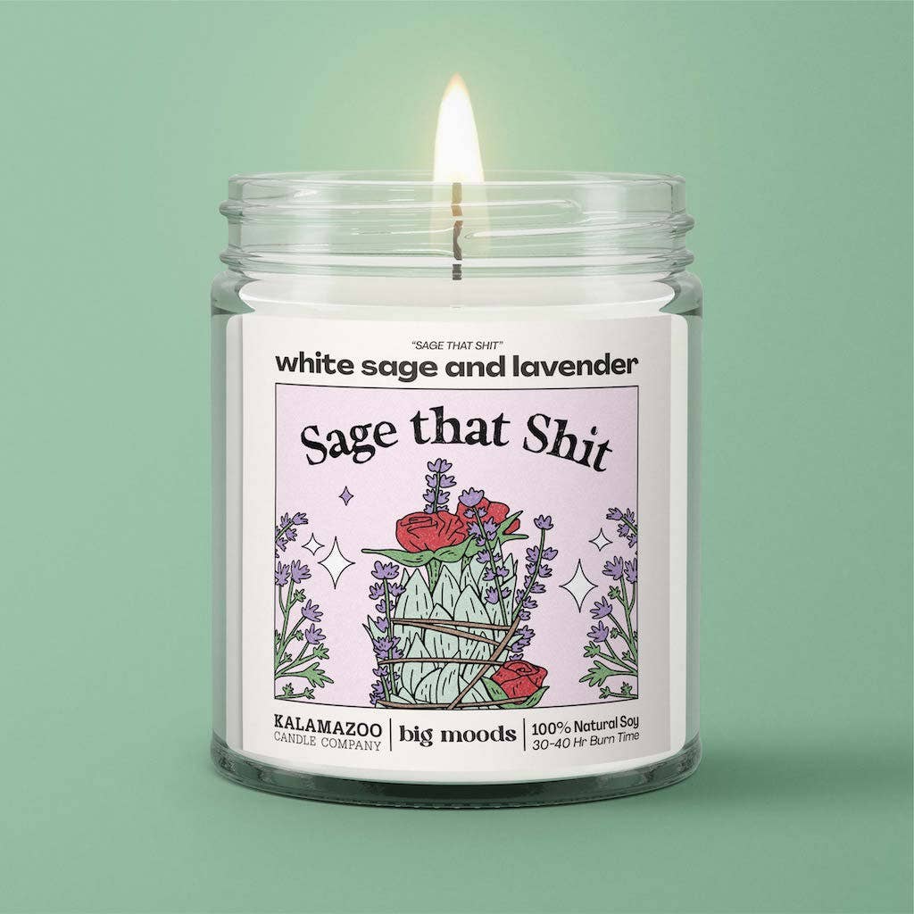 Candle in a glass jar with a colorful label on a green background