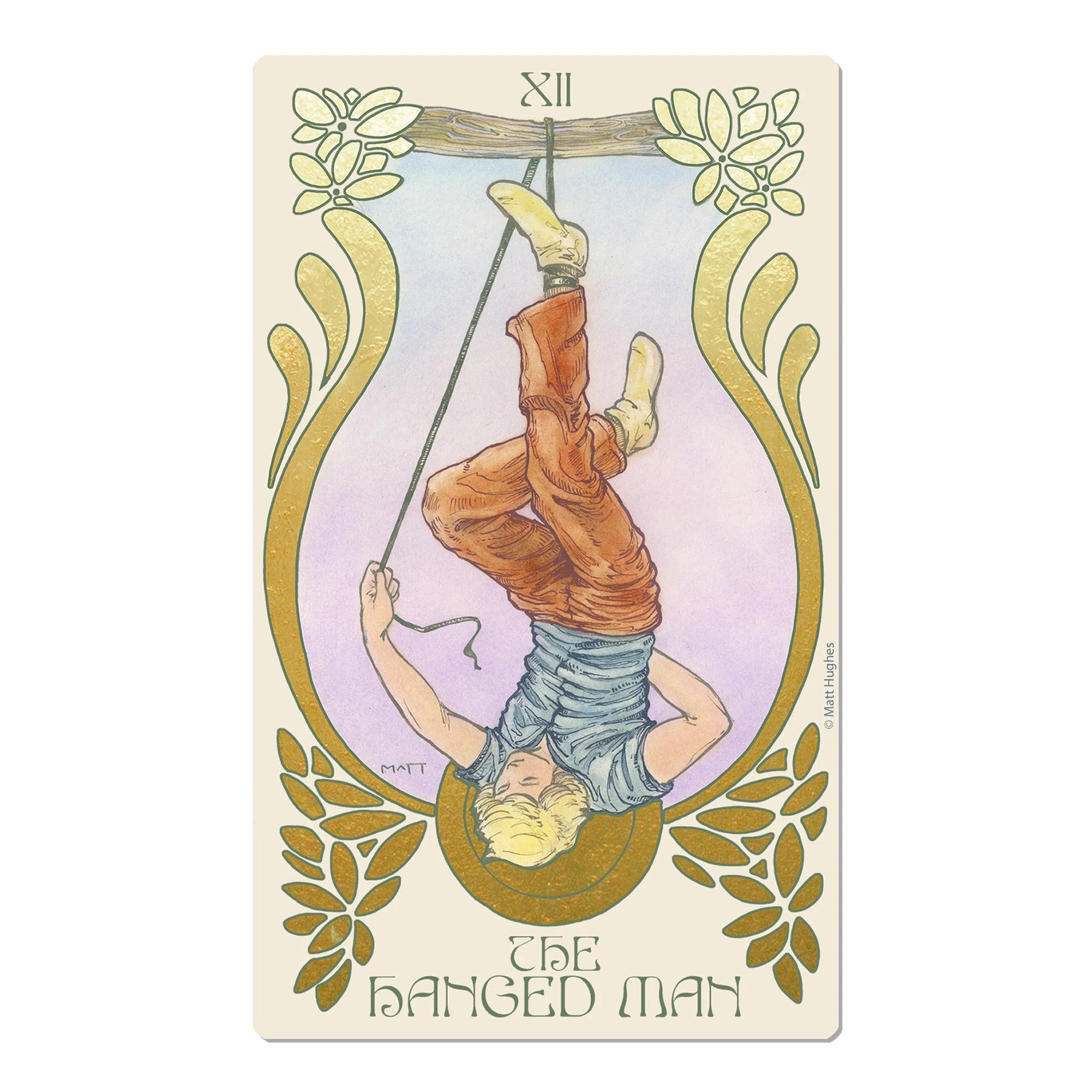 The Hanged Man tarot card featuring an illustration of a man hanging upside down from a branch, framed by gold botanical flourishes on a cream background.