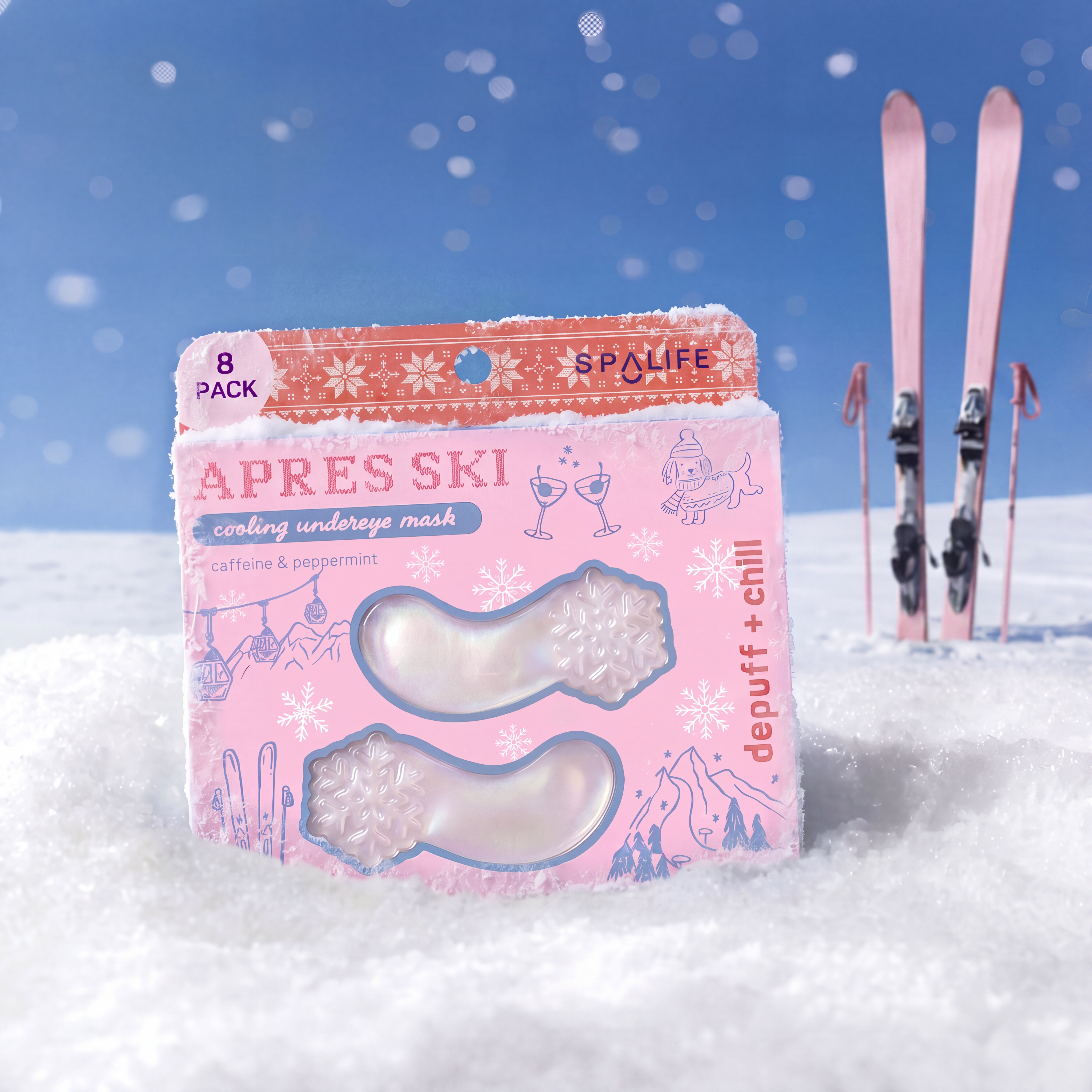 A pink and orange box of SPALIFE 'APRES SKI' cooling underneath masks, styled in a snowy outdoor setting with skis in the background against a blue sky.