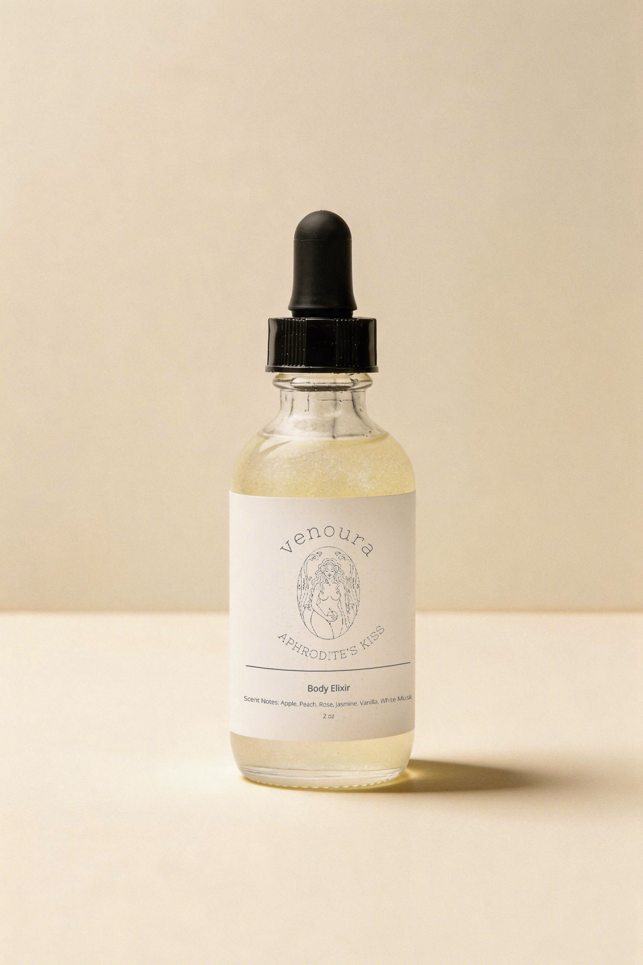 Venoura Antioxidant Serum in a clear glass dropper bottle with a white label and black dropper cap, set against a warm beige background.