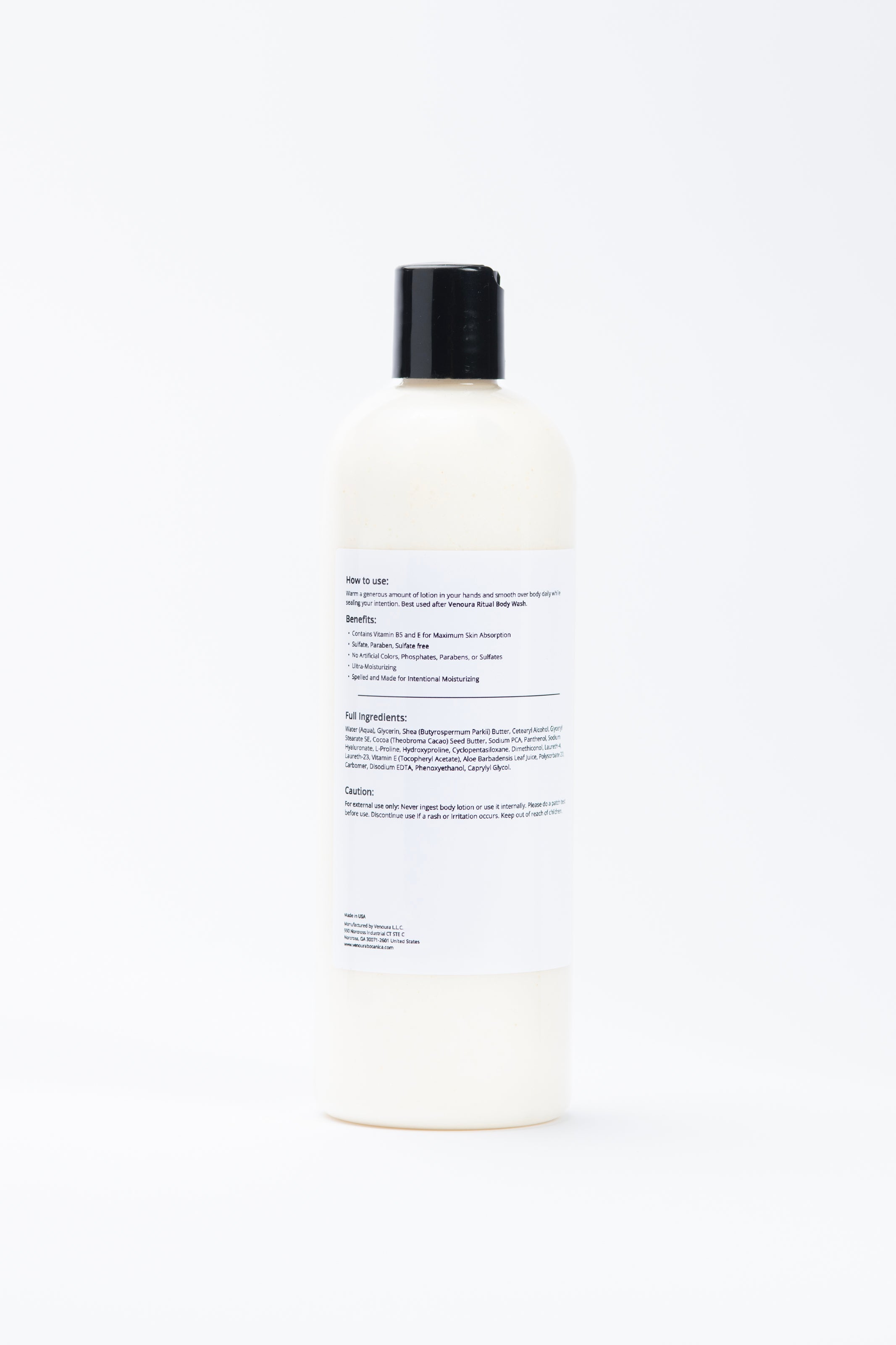 A tall, off-white plastic bottle with a black cap, shown from the back against a seamless white background. The back of the bottle features a large white label with black text.