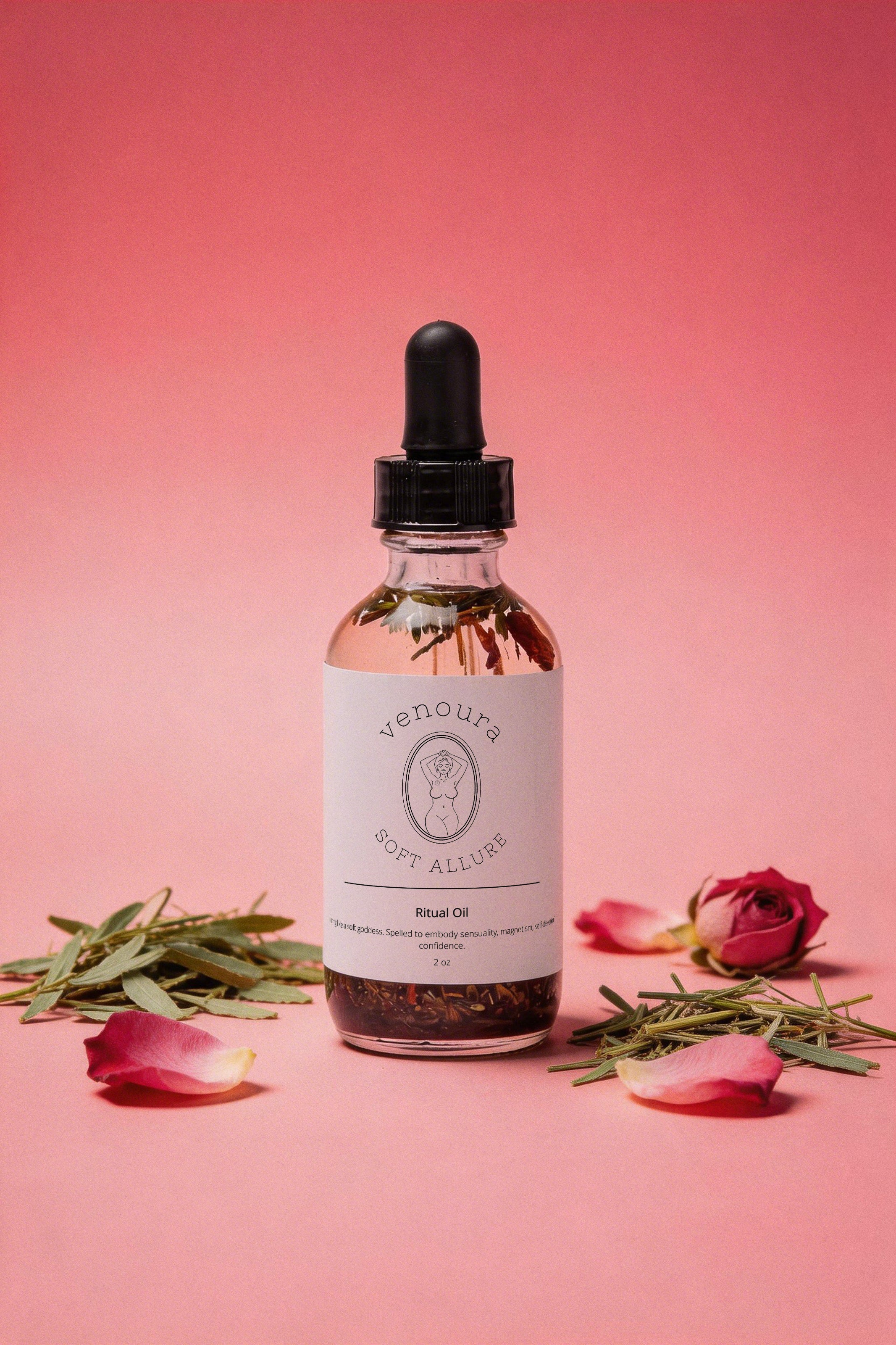 Venoura Soft Allure Herbal Ritual Spiritual Oil used for invoking sensuality, magnetism, and allure, in a clear glass dropper bottle with a white label, styled on a pink background with rose petals, rosemary, and eucalyptus.