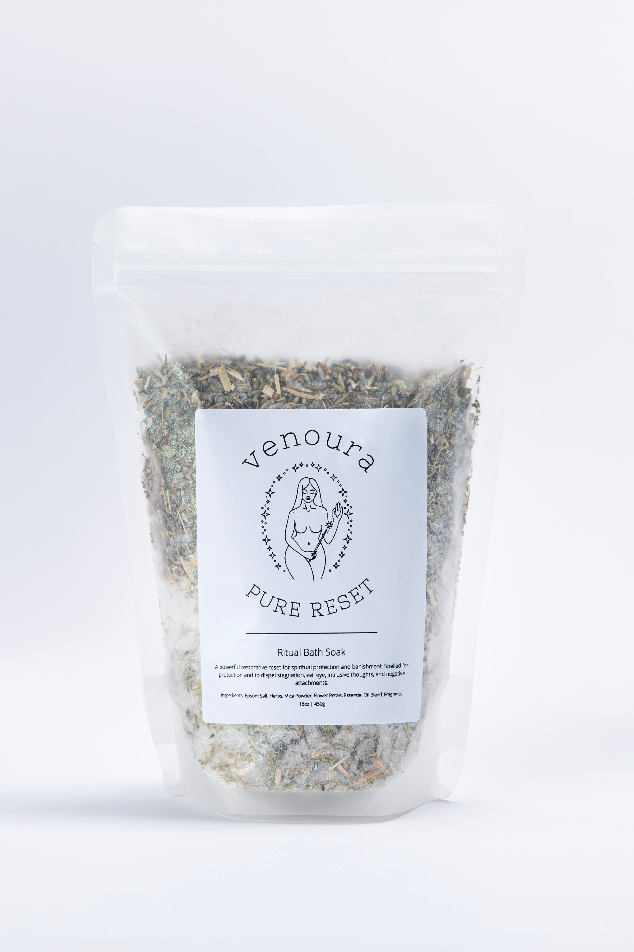 Venoura Pure Reset Ritual Bath Soak in a clear resealable stand-up pouch with a white label, showing the dried herbal blend inside, on a light gray background.